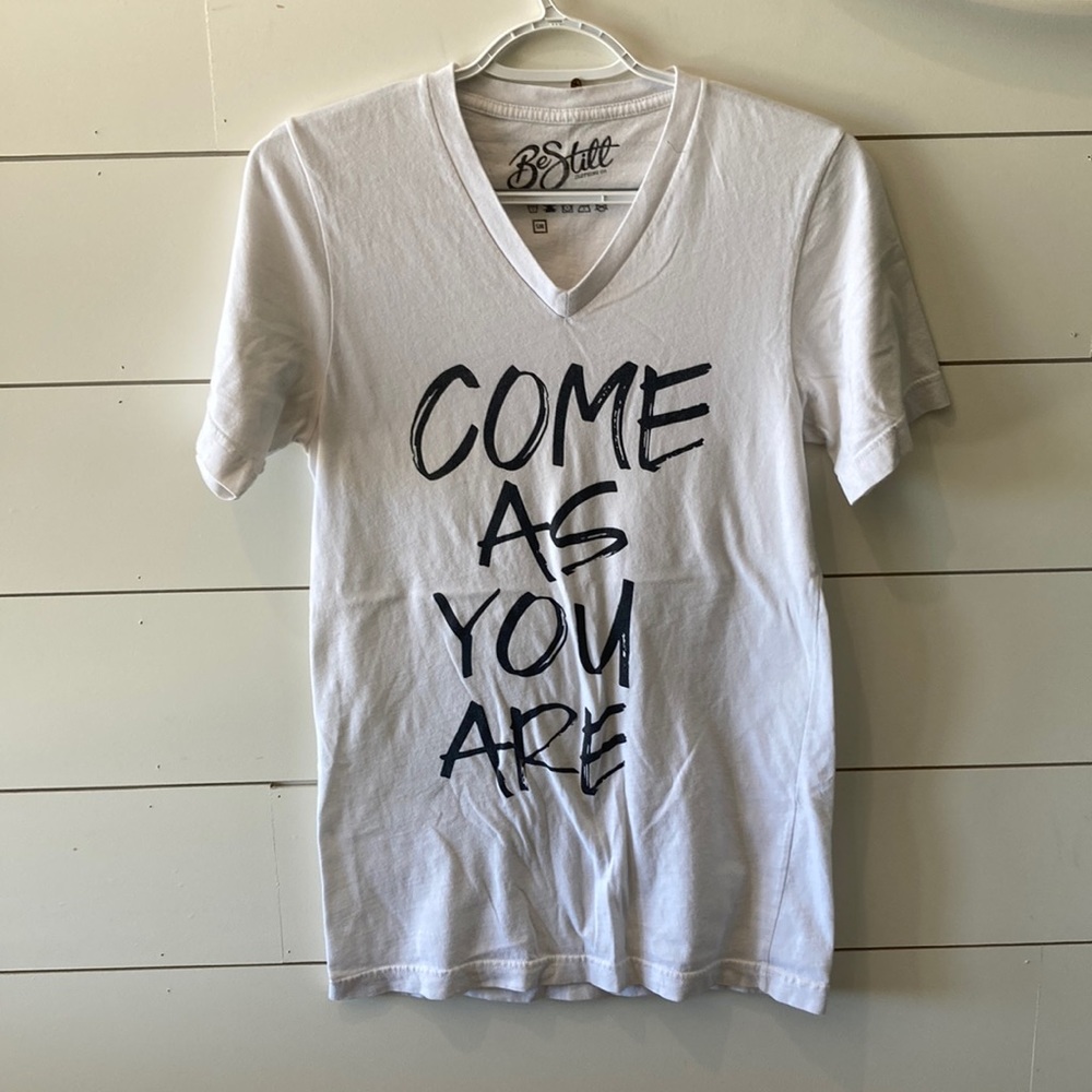 BE STILL. White v-neck. come as you are